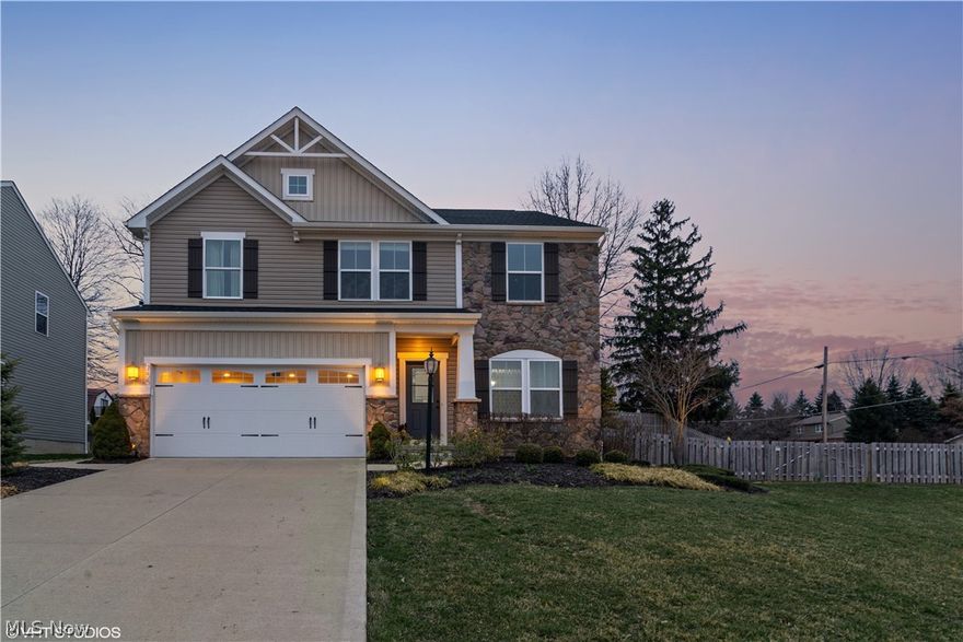 Welcome to 755 Olympic Way! This 3 bed, 3.5 bath former model home is full of updates. Step inside, noticing beautiful hand scraped hardwood floors throughout the entire 1st floor and a sitting room w/ industrial built-ins to your right. Continue into the open concept living room and kitchen. The gas fireplace with stone surround adds comfort to the home. The kitchen features  pull-out drawers, granite counters, stainless steel appliances (all stay), tile backsplash, large center island with granite, and plenty of storage. The sunroom just off the kitchen is bright with vaulted ceilings and access to the patio and fenced in back yard. A half bath, mud room, and formal dining area wrap up the main level. Journey upstairs to an oversized master suite with lots of natural light and two generous walk-in closets. The ensuite features granite counters, a large soaker tub, and tile shower with glass surround. Two large bedrooms, another full bathroom, and second-floor laundry room with newer