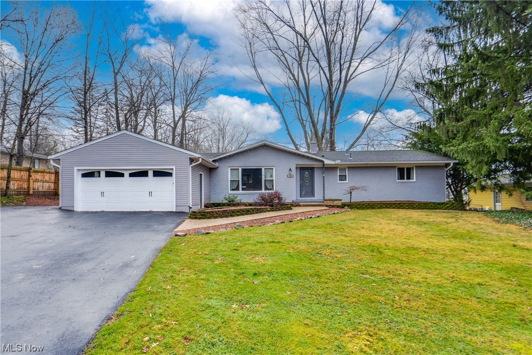 Welcome to this fabulous ranch-style home nestled in the serene Tallmadge neighborhood. Located on a quiet dead-end street, this home boasts an impressive 2080 square feet of living space plus an additional 700 square feet in the finished lower level. This home has been fully remodeled within the last five years, offering a blend of modern amenities and classic charm. Upon entering, you'll be greeted by the open layout featuring four bedrooms on the first floor, with the potential for a fifth in the lower level. The primary bedroom is complete with a generously sized walk-in closet and a beautiful ensuite bathroom, perfect for unwinding after a long day. Additionally, the second bedroom also enjoys the luxury of a private full bathroom. Hardwood floors adorn the entirety of the first floor. The convenience of a large first-floor laundry area off the mudroom enhances the functionality of the home. Entertainment possibilities abound in the lower level, where you'll find a large rec room and another full bath. Fresh paint in the primary bedroom and kitchen in 2024 adds a touch of modernity and crispness to the already inviting spaces. The back of the home features a covered patio and nicely sized, fenced back yard. With its thoughtful upgrades, spacious interior, and tranquil location, this home offers a perfect blend of comfort and style, promising a lifestyle of ease and enjoyment for its fortunate new owners.