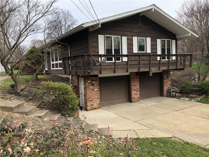 Country Living in the City of Strongsville! This Four Bedroom Strongsville Ranch with Wood Burning Fireplace is located near the Metro Parks is close to Shopping, Highways, and Much, Much, More. Cabinetry. Wainscotting in dining room. Relax on a 24'x24' Deck and survey the Country-like Setting of Your Back Yard.  Fully Applianced, Nicely Sized, Updated Eat-In Kitchen awaits. Home Warranty Included!