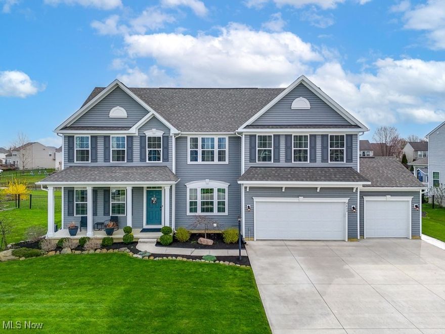 Looking for a home in North Ridgeville? Check out this absolute gorgeous home located in Winfield Farms! Just minutes from Rt. 10 and 480. Easy drive to downtown, stores, and local restaurants! This home is the Corsica model built by Ryan Homes. Offering 3640 square feet of living space with 5 bedrooms and 4 baths. A wide-open floor plan including an added stone fireplace and a 4-foot bump out with additional windows. An eat in kitchen area with a massive island and pendant lighting. A walk-in pantry helps keep things organized. The master bedroom has his & her walk-in closets with a large bathroom that has a double vanity. Two of the additional upstairs bedrooms include walk in closets. This home has a first-floor office with French doors.  Followed by an additional 1200 plus square foot finished basement. The basement buildout offers a huge open layout with a full bar area that includes a wet bar, dish washer, bottle shelves, glass front cabinets and more! The basement has an open living space perfect to host the next big game or movie night! This house has so many amazing features including a covered front entry, 2nd floor laundry, formal dining room, eat in kitchen, island with seating, beautiful kitchen with granite countertops, stainless steel appliances, and subway tile backsplash. The three-car garage has plenty of room for larger vehicles. Not to mention the extra wide three car driveway. The beautifully landscaped yard has an irrigation system to keep your lawn looking green! When exiting the back of the house you walk onto a stamped concrete patio followed by a beautiful backyard to sit and enjoy your evening by the fire pit! An area sure to entertain your guests for summer cookouts or dinner with the family!