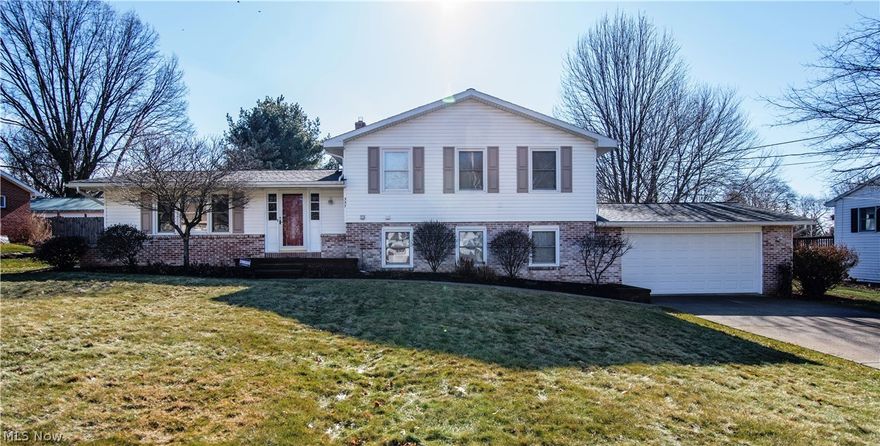 Charming and cozy!!  Enter this split level home designed for Happy Living!   3 bedrooms with an additional room for 4th bedroom or office.  Formal living room, 2 full baths, spacious kitchen and dining area with Oak Craft maid cabinets and hardwood flooring.  Sliding glass doors lead to large 3 level deck and inviting fenced in back yard.  Cozy up to the gas fireplace in the family room or enjoy the bonus sun room surrounded by windows with 4 skylights and a thermostat regulated gas stove.  Attached 2 car garage and full basement gives plenty of storage area.  All appliances plus washer and dryer included.  The home has been consistently maintained and is ready to be enjoyed.  Call today for your private showing.