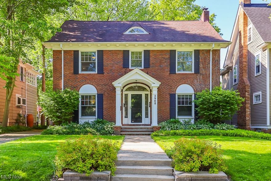 Don't miss your chance to own this gorgeous, renovated century home in Cleveland Heights! This classic center hall red brick Colonial gem has all the beautiful architectural details including exterior dental molding, original hardwood floors and archways of the era. The spacious living room features a beautiful fireplace, abundance of windows and classic moldings.  Walk through the living room to a cozy and bright four seasons room. Enjoy entertaining in the lovely fully fenced backyard with a large brick patio. The spectacular kitchen boasts custom cabinets, granite counters, designer back splash, breakfast bar & stainless-steel appliances. The kitchen has a large opening to the dining room, perfect for those large gatherings or a simple elegant dinner. Beautiful original hardwood floors cover most of the first & second levels. The generous owner’s ensuite has a newer private full bath & spacious walk-in closet. Two additional bedrooms and a remodeled hallway full bathroom complete th
