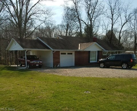 Beautiful one acre lot on a light traffic north end street and close to mall, hospital, doctors and recreation. West Muskingum Schools. Beautiful home, mostly brick with 1232 sq. ft. of living area. One car attached garage and a one car carport. Very unique floor plan with 3 bedrooms and full bath on second level and an elevated balcony overlooking the main living area. Ready to move into!