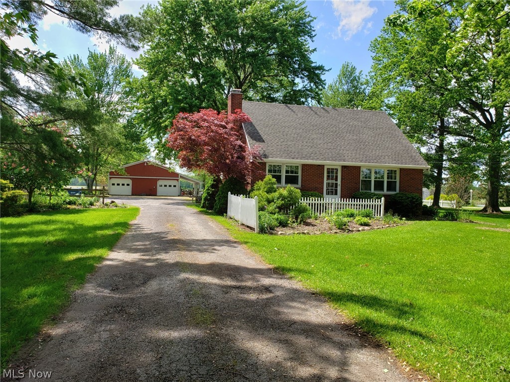 4.99 acres with a pond, ideal for horses or other animals. Move in condition , this nice 2 story brick home is maintenance free. 30 x 40 Barn with a 10 x 30 porch, 220 electric, frost free hydrant . 30 x 44 pole barn for storage, gravel .
