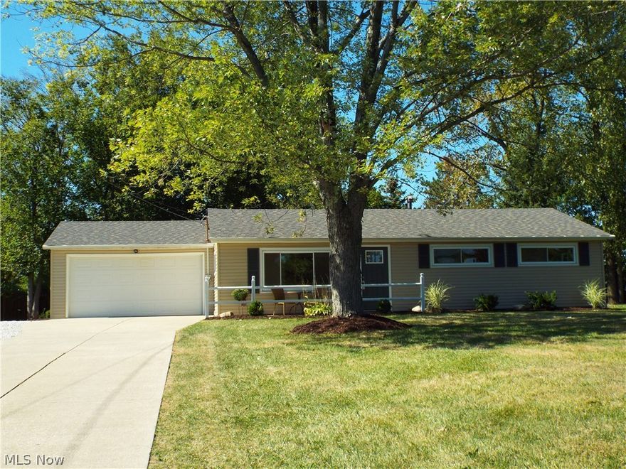 Spectacularly remodeled ranch style home in Streetsboro. Newer roof & windows along with a concrete drive with turn-around. Kitchen has laminate floors with cherry cabinets, prep island, granite counter tops and stainless steel appliances. This eat-in kitchen also looks out the sliding glass doors to the spacious, over half acre lot. Home has been freshly painted throughout with new carpeting in every room. Bath has been updated with a new vanity, brushed nickel fixtures and porcelain tile tub/shower surround, along with porcelain tile on the floor. All lighting fixtures have been upgraded as well. There is an attached two car garage with additional storage along with a 10 x 10 storage shed at the back of the property. Should you want additional privacy, the back yard has all the upright fence posts in place to just add your privacy fence and you will be completely secluded in your own personal oasis. Home has been nicely landscaped and just waiting for your personal touches. This home