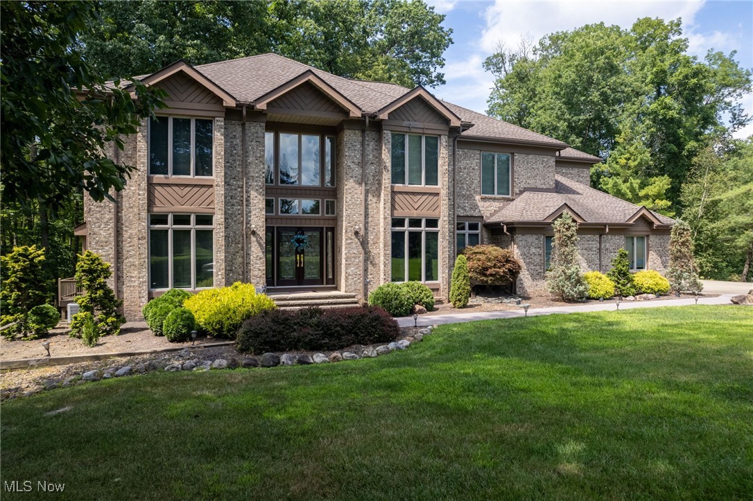 Welcome to this stunning colonial in the highly sought-after Reserve neighborhood in Medina. Featuring 5 bedrooms and 4.5 baths, this home offers spacious living for family and guests alike. The two-story great room with gas fireplace and it is filled with natural light and exceptional views. The great room flows into a spacious kitchen with granite countertops, leaded glass doors, and Kraftmade cabinets. The living room/office features a gas fireplace. The dining room features a trey ceiling. The sprawling owners suite boasts a luxurious en suite bath with soaking tub, tiled shower, dual vanity with granite countertops, and a huge custom walk-in closet with skylights. Upstairs there are 3 additional spacious bedrooms. One bedroom has a private bathroom and the other two have a Jack-n-Jill bath. Enjoy convenient first-floor laundry and a 3-car garage. The walkout basement offers a bedroom, full bath, large rec reoom with gas fireplace, bonus room, and direct access to multiple decks with breathtaking views of the peaceful surroundings. Outdoor living shines with spacious decks and a patio, paths, trellis, as well as gardening shed. The outdoor grill and patio furniture are included. The hot tub and the Traeger smoker are negotiable. TVs with mounts stay for your convenience. All appliances remain—move right in and enjoy this exceptional property with its perfect blend of comfort, elegance, and serene setting.