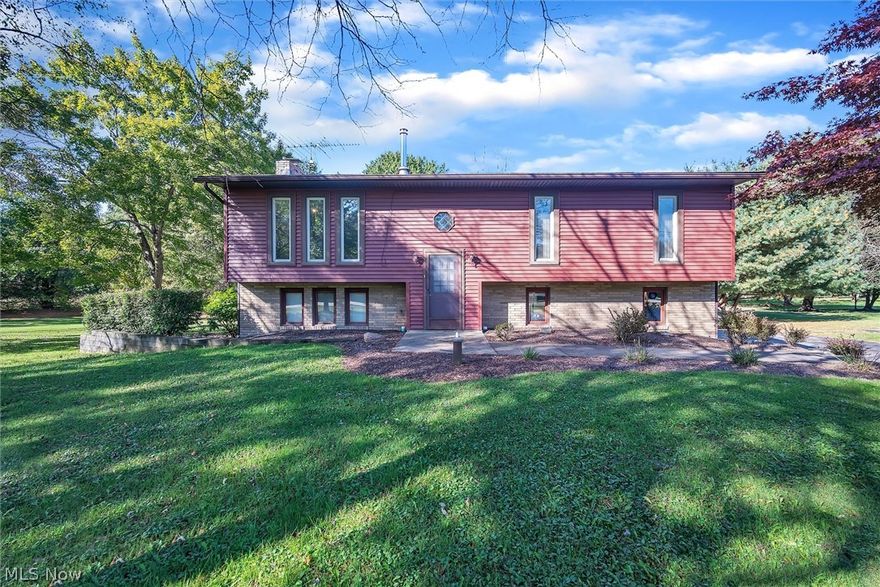 Welcome home! A Bi-level home on a park like 3+ acre property with mineral rights. Family room boasts ceramic floors with a wood burning fireplace for those cooler evenings. A large eat-in-kitchen with stainless steel appliances and access to a large raised deck that overlooks the wooded back yard. On the lower level you'll have privacy with a bonus room with another fireplace that can be used as a multipurpose space which also leads out to the back yard. Lower level also has a large laundry room area with a full bath and access to the 2 car garage. Don't miss this opportunity to Make It Yours!