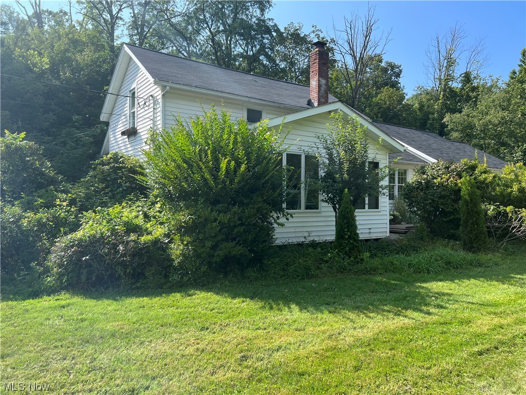 Renovations have begun and half the work has been completed to make this home your own! Original house in front with new addition added in 2006. Newer windows in most of home, newer siding and newer HVAC system. Recently built 3 car attached garage with electric garage door openers and water access. Located within Chagrin Falls school district with Geauga taxes. Large wooded lot for privacy. Close to charming downtown Chagrin Falls and all it has to offer!