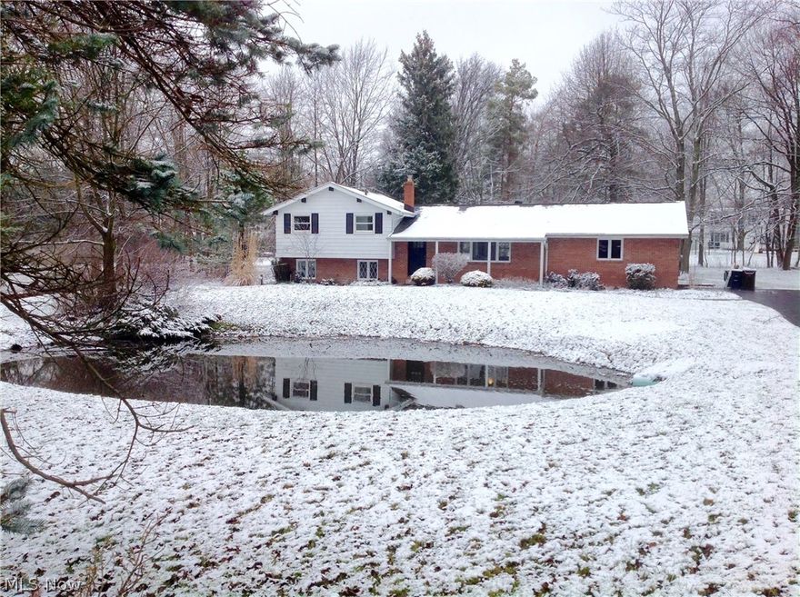 Stunning 3 bed 2 bath split on a beautiful 1+ acre private wooded lot with pond. Beautifully remodeled through-out. Vaulted  great-room, fresh white paint and luxury vinyl flooring in all rooms.   Brand new kitchen features Quartz countertops, High quality cabinets,  center Island, All brand new stainless appliances. New Modern light fixtures. Stunning stainless Cable railing.  Both full baths remodeled. Just 3 steps down to family-room and private laundry area. Septic updated. New landscaping.  Orange School district. Close to Pinecrest shopping and restaurants and short drive to Chagrin Falls.