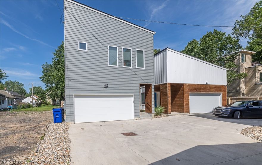 This beautiful, modern three bedroom Colonial is located in Tremont’s trendy social community that offers craft coffee shops and popular eateries nestled between restored Victorian homes. This property has a tax abatement until 2034, which offers incredible savings over the years. “Top-of-the-line” is the hallmark of this home with upgrades that include a finished basement, custom cabinets and quartz counters, flooring, tile, showers (dual heads for master shower), tankless water heater, insulated garage, wine cellar, upgraded light fixtures, gas line to patio, solid core interior doors and more. The kitchen is a chef’s dream with a 6 burner commercial gas Thermador range, Thermador 36” hood with 1000 CFM blower, Thermador refrigerator with 2 door bottom freezer, and Thermador dishwasher. Included in many of the updates is a maintenance free back yard with Pet Turf installed which eliminates mud and increases cleanliness, a natural gas fire pit, leaf guards for gutters and Aprilaire wh