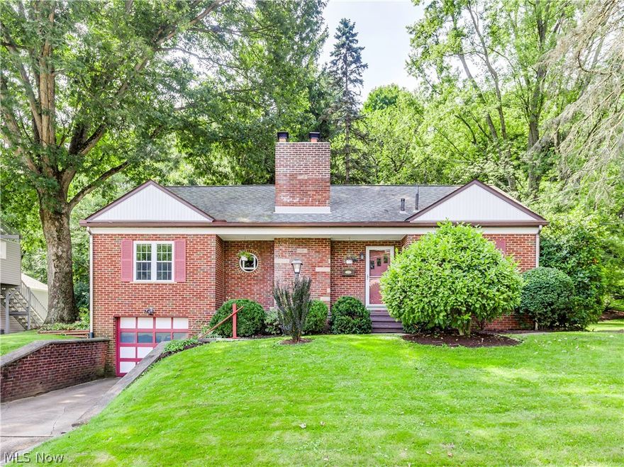 Amazing property in North Canton! Brick bungalow with an amazing view. Just under a half acre lot with pretty trees, landscaping and deer frolicking through the backyard. The property butts up to 7 acres of woods that provides a picturesque setting all year around. Enjoy entertaining on the large deck in the back yard. In the winter time you will still enjoy the beauty from a large picture window in the living room cuddled up to the gas fireplace. 2 car tandem garage provides plenty of room for storage and convenient access to the basement that holds a ½ bath, second family room, laundry and workshop. Lots of storage still available on this lower level. Large living room with gas fireplace is the center of the home. Large dining room and kitchen are great for entertaining and preparing for special occasions. Two bedrooms are on the main living floor situated on either side of the full bath. A glass paned wood door makes access from the deck to the bath or bedroom very convenient. The u