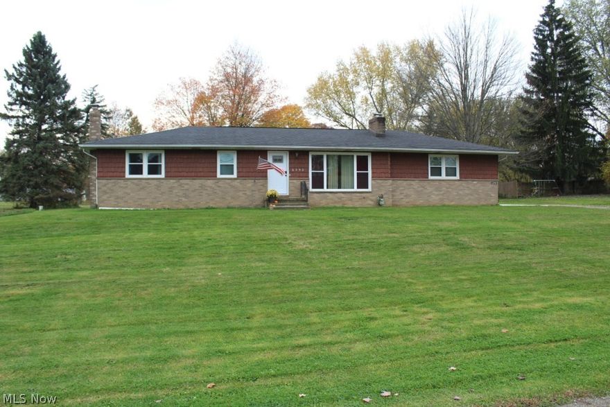 Wonderful Nimishillen Twp/Louisville SD ranch on huge lot! All new laminate wood floors throughout, original wood floors in bedrooms.  Fireplace in living room and nice woodburner in large basement, with office/bonus room in basement.  All appliances with washer/dryer negotiable.  First floor laundry!  200 Amp service, most windows (except 2) newer and glass block in basement.  All bedrooms have double closets and original hardwood floors ready for you to refinish or cover.  All new interior and exterior doors and rear covered patio.  Over-sized 2 car attached garage.  Newer well pump in 2016.  Public sewer and township property with no city income taxes based on location.  Close to everything and approx. 1 mile to Rt. 62!