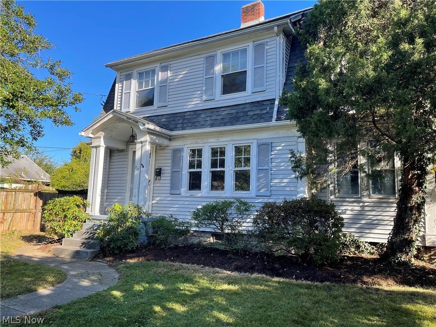 Ready for your tender touches. It makes a nice presentation as you drive up and walk to the front door. You walk into a large living room with decorative fireplace. Small room can be used as a bedroom if you desire. Dining room and kitchen flow well. A screened room off the kitchen. 2 bedrooms and full bath upstairs. PLUS: Garage turned into a studio or separate quarters. Alley access to the backyard.