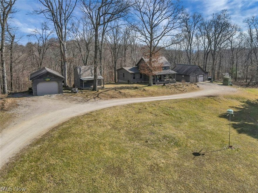 1925 sf +/- log home on 2.159 total acres. Original part of the home built in the late 1700's. Relocated to this site and restored in 1990. A large master bedroom was added to the home. Full private bathroom for the master bedroom with a shower.  Bedroom 2 is located on the 2nd floor. Kitchen area with oak cabinets & plenty of counter space. Stainless steel appliances, including refrigerator, stove & microwave, stay with the home. Large rustic living room with exposed logs & beautiful hardwood floors. Sun room with great views, a fireplace & bar area. Additional full bathroom with tub/shower combo. Walk out finished basement with a wood burner with thermostat. Basement has a ton of storage, counter space & a laundry sink—washer & dryer located in the basement utility room. Electric water heater, gas furnace & house are wired for generator & security system. Drilled water well & septic system. Home has a covered front porch & a concrete patio area. Workshop or detached 2-car garage has heat, A/C, water & electricity. Guest cabin with covered porch, water & electric. Additional buildings include a 1-car garage, chicken coop, garden shed, and sauna. West Muskingum School District &  taxes are approximately $3888.04.