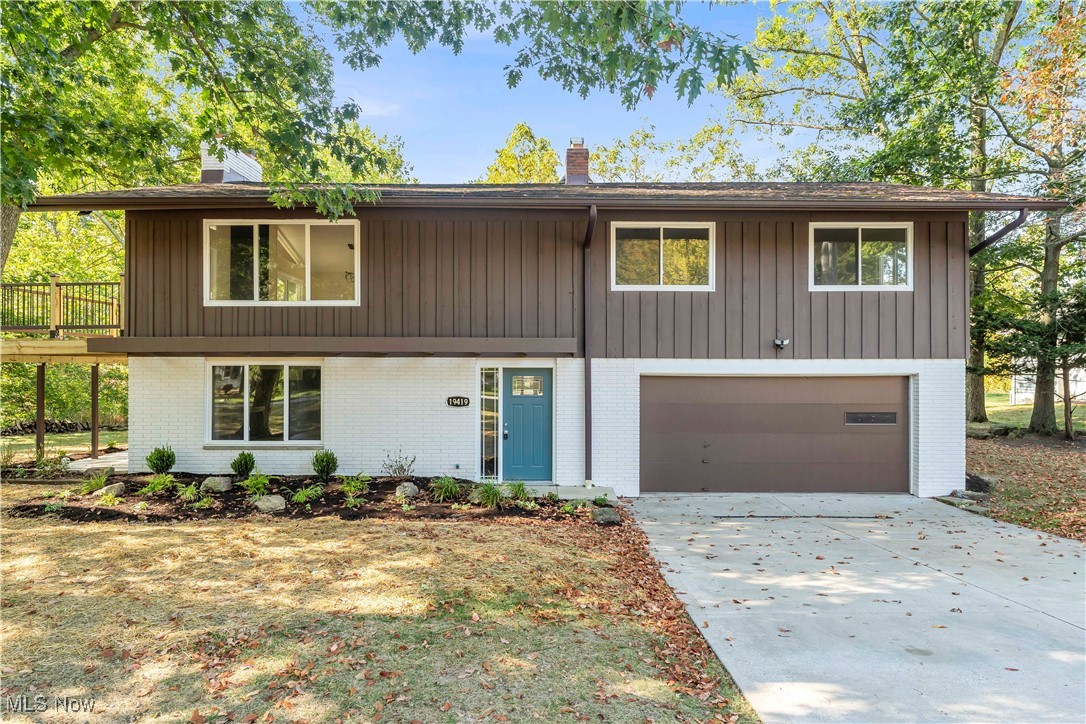 Nestled on a sprawling 1.5-acre, tree-lined property with a peaceful creek running through, this fully remodeled Middleburg Heights home offers breathtaking views from both the patio and private balcony! The private lot offers endless possibilities for gardens, recreation, or outdoor entertaining! The dramatic full-length stone fireplace serves as a stunning focal point in the spacious living room! This entry level also features a large laundry room and a full bathroom with a standing shower, with access to the covered patio for effortless indoor-outdoor living! Upstairs, the main living area impresses with vaulted ceilings, recessed lighting, an exposed beam, and a striking floor-to-ceiling brick fireplace that anchors the space beautifully! The gourmet kitchen is a true showpiece, boasting granite countertops, a large island with seating and cooktop, elegant backsplash, new cabinets, and stainless-steel appliances — perfect for entertaining or everyday living! Down the hall, three generously sized bedrooms share a remodeled full bathroom with stylish tile and modern fixtures! Every detail has been thoughtfully upgraded, from new LVP flooring and fresh paint to updated light fixtures, two cozy fireplaces, and a garage refreshed with epoxy flooring and a new opener! Comfort and efficiency are ensured with a new furnace, AC, hot water tank, updated electrical, new windows, gutters, and freshly painted brick exterior! The outdoor spaces are just as impressive, with a brand-new deck, patio, and professionally landscaped grounds that enhance the home’s natural charm! Perfectly located in Middleburg Heights, this home offers access to local favorites like Arena 51 Laser Tag, Stonebrook Driving Range, Isaac Lake, and Fat Head's Brewery, as well as easy travel via I-71, I-480, and the Ohio Turnpike (I-80)! This property isn’t just a house — it’s a lifestyle! Don’t miss your chance to make it yours; schedule a private showing today and experience all it has to offer!