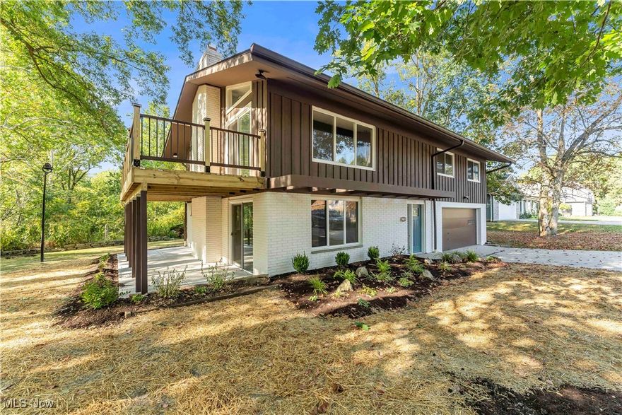 Nestled on a sprawling 1.5-acre, tree-lined property with a peaceful creek running through, this fully remodeled Middleburg Heights home offers breathtaking views from both the patio and private balcony! The private lot offers endless possibilities for gardens, recreation, or outdoor entertaining! The dramatic full-length stone fireplace serves as a stunning focal point in the spacious living room! This entry level also features a large laundry room and a full bathroom with a standing shower, with access to the covered patio for effortless indoor-outdoor living! Upstairs, the main living area impresses with vaulted ceilings, recessed lighting, an exposed beam, and a striking floor-to-ceiling brick fireplace that anchors the space beautifully! The gourmet kitchen is a true showpiece, boasting granite countertops, a large island with seating and cooktop, elegant backsplash, new cabinets, and stainless-steel appliances — perfect for entertaining or everyday living! Down the hall, three generously sized bedrooms share a remodeled full bathroom with stylish tile and modern fixtures! Every detail has been thoughtfully upgraded, from new LVP flooring and fresh paint to updated light fixtures, two cozy fireplaces, and a garage refreshed with epoxy flooring and a new opener! Comfort and efficiency are ensured with a new furnace, AC, hot water tank, updated electrical, new windows, gutters, and freshly painted brick exterior! The outdoor spaces are just as impressive, with a brand-new deck, patio, and professionally landscaped grounds that enhance the home’s natural charm! Perfectly located in Middleburg Heights, this home offers access to local favorites like Arena 51 Laser Tag, Stonebrook Driving Range, Isaac Lake, and Fat Head's Brewery, as well as easy travel via I-71, I-480, and the Ohio Turnpike (I-80)! This property isn’t just a house — it’s a lifestyle! Don’t miss your chance to make it yours; schedule a private showing today and experience all it has to offer!