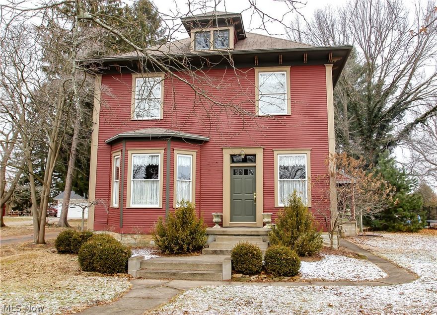 Beautiful home , full of character, charm, and original wood!!  Starting in the kitchen with custom cabinets, recessed lighting, island bar, and is fully applianced. Huge living room with built in bookcases. Pocket doors between living room and dining room. Dining room has built in china cabinet. 1/2 bath downstairs has custom built pantry and storage drawers. Upstairs has 3/4 bedrooms or could have office area in one. Second floor laundry for your convenience. New carpet in all bedrooms. This home has a newer high efficiency furnace. Newer wood windows through out. Most custom window treatments stay. 30x48 Garage / Building with furnace, electric, water, and an upstairs that is ready for your man-cave or studio. Over 3/4 of an acre that leaves plenty of room to roam.