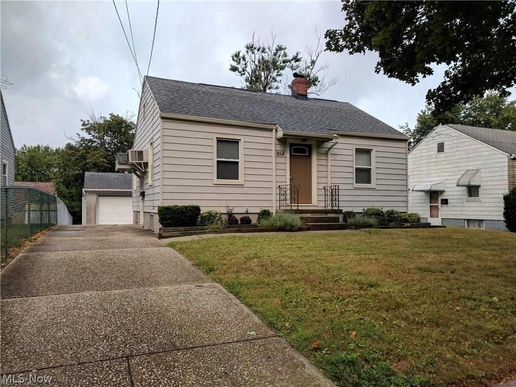 Great starter home available in East Akron! This home features two spacious bedrooms with nice sized closets. New carpet in both of the bedrooms and living room (2016). Charming full bathroom completely renovated in 2006. Sufficient sized eat-in kitchen with hardwood flooring. Fresh paint throughout! Full basement with plenty of storage space! Plenty of space in the oversized 2 car garage. Desirable little patio in the backyard. Fenced in area, great for pets, kids or a garden! Many updates include hardwood flooring in the kitchen and hallway (2000) Kitchen updates (2015) Windows in basement (2008) Hot water tank (2015) Roof and gutters (2015).