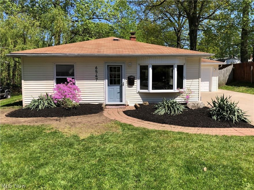 Move right in to this beautifully updated 3 bedroom, 1 bathroom ranch in Mentor only a mile away from Lake Erie. This home features brand new luxury vinyl flooring in the main living room, all new baseboards throughout, wood grain ceramic tile in the kitchen, new designer lighting, LED lighting in the bedrooms,  bathroom and hallway, brand new Samsung fingerprint resistant black stainless steal appliances, a high efficiency furnace, central AC, fenced in backyard, large deck for relaxing or grilling out, new garage door, new full view storm door, vinyl double hung windows, large concrete drive, and an additional living space separate from the rest of the house. The large additional living space could be a family room, play room or home office. The bathroom has been completely remodeled with a new shower surround, new waterproof vinyl flooring, new vanity, new fixtures and a new Kohler toilet. The house is situated on a quiet street, nearby to schools, shopping, restaurants, transportat