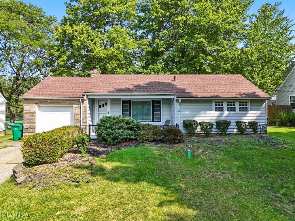 Delightful ranch located in Seven Hills featuring numerous enhancements! A spacious front porch welcomes you, leading directly into the expansive living room, which offers a fireplace and highlights the hardwood floors that span the main level. French doors invite you onto the large back deck that overlooks the recently fenced . 55-acre property. Central to the home, the kitchen boasts fresh paint and revamped countertops. The modern design aesthetic flows into both bedrooms, each with distinctive feature walls. The bathroom, renovated in 2019, includes heated floors! In the lower level, you'll discover a vast finished recreation room adorned with newer wood laminate flooring (2020), along with a laundry space that provides ample storage. Additional updates include a high-quality furnace and a/c system (2020), hot water tank 10/2021. Furthermore, it offers convenient access to I-77 and numerous shopping options on Broadview Rd, located just a few minutes away!