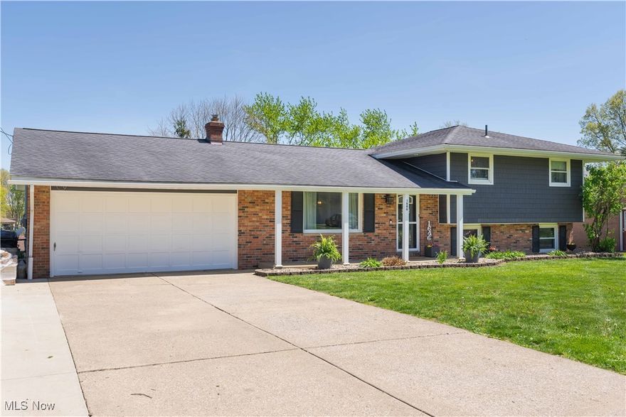 This is the home you have been waiting for to come on the market! Take a look at this updated 4 level split in Perry Township. The open floor plan & rear yard allow you to entertain with ease & enjoy those summer days. Step inside the front door to find an open & bright main level with laminate flooring. The living room is full of natural light from the large picture window & flows into the updated beautiful kitchen. The kitchen offers quartz counter-tops, beverage fridge, black stainless steel appliances, farm sink, open shelving, built in cabinetry and bench for seating. The kitchen & lower level sliding patio doors lead you to a back yard oasis.  The rear yard features and expansive patio area, composite deck, storage shed, putting green, & above ground pool. The lower level offers a family room with built in shelving, electric fireplace, full bath & 4th bedroom. The second floor offers 3 bedrooms and main bath with tile flooring & double vanity sinks.
