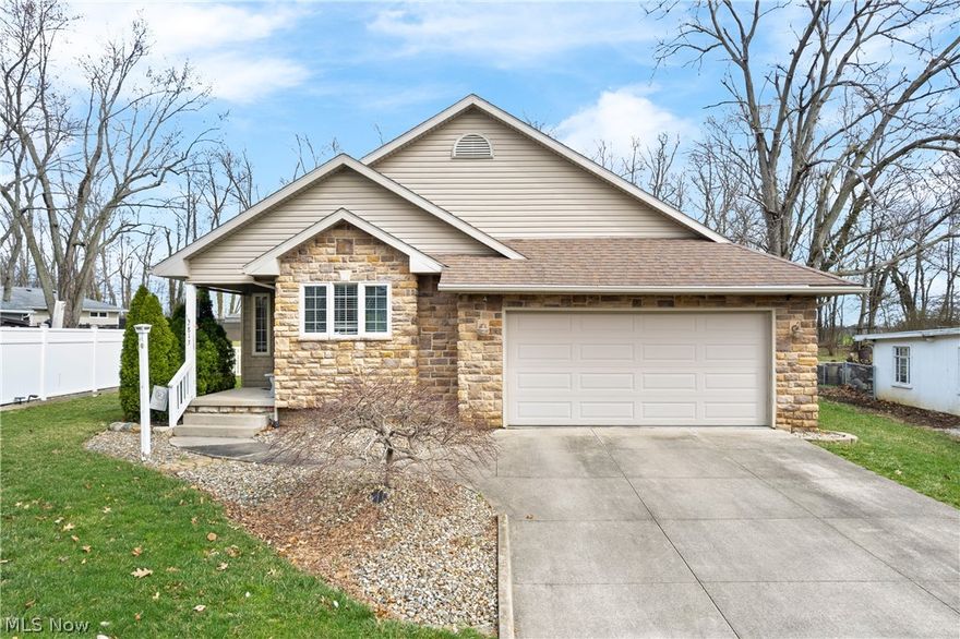 Welcome to this beautifully maintained ranch in desirable Lakewood Heights near the Portage Lakes area! Built in 2006, this spacious 3-bedroom home offers over 2,800 square feet of finished living space and sits on just under a half-acre lot in a quiet neighborhood setting. Step inside to an open floor plan featuring a bright living area that flows seamlessly into the kitchen and dining space, creating a perfect layout for everyday living and entertaining. The seller has recently updated the main level with durable luxury vinyl plank flooring throughout, giving the home a fresh and modern feel. Convenience is key with a first-floor laundry, while the finished lower level adds exceptional additional living space, complete with a bar area, full bathroom, and additional laundry hookup, making it ideal for gatherings, recreation, or guest accommodations. Outside, enjoy the private backyard and relaxing back porch, perfect for summer evenings or morning coffee. The property offers a comfortable yard size of less than half an acre, providing space to enjoy without excessive maintenance. Located in the Lakewood Heights subdivision, this home is just minutes from the Portage Lakes area, offering access to boating, parks, golf courses, dining, and entertainment, while still providing easy access to major routes, shopping, and everyday conveniences. A rare opportunity to own a move-in ready ranch with modern updates, finished lower level, and prime location near the lakes.