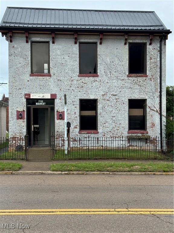 Historic downtown Gem with it's own 26 car Parking Lot! Are you ready to turn your business dreams into reality? Look no further than this historic building in the heart of Zanesville. This property enjoys excellent visibility, foot traffic, and car traffic. Whether you are opening a boutique, a cozy cafe, or a creative studio, apartments, restaurant, etc. this address will make your business stand out. The inside demo has been done so you can visualize your own ideal layout. Picture higher ceilings, original hardwood flrs, gas log fireplace in original fireplace, and large windows allowing for natural light. Customers do not have to circle the area looking for a space to park, you have your own parking paradise! Historic charm, demo done so you have a blank canvas, building has a NEW Metal roof and gutters, plus wood replacement. Who knows what stories these old brick walls hold. Put your business on the first floor and an income producing apartment above. Don't miss your opportunity to own this! Call today to schedule your appt!