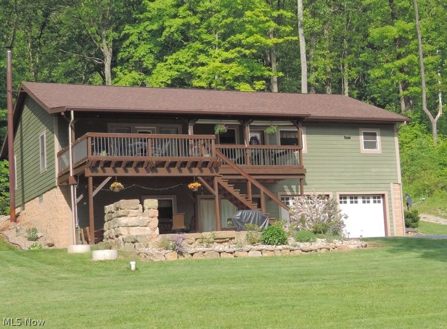 Here is a great quality home sitting on 12+ acres. Hunt in your own woods. Loads of quality throughout this open floor plan with beamed ceilings, oak hardwood floors & trim, hickory kitchen w/island, stainless appliances & slate flooring. Walk-in pantry w/first floor laundry. Master suite has full bath with river stone flooring, whirlpool tub & glass walk-in shower. Lower level is finished with 9-ft. ceilings, has a stone wall with Vermont casting wood burner stove, oak kitchen area w/built-in range & a pool table. The media/family room is complete with high def projection TV. From the lower level, enjoy the flag stone patio w/a built-in fire pit. This home has a lot of extra quality features. Geothermal heating system ($140 avg. electric), Pella windows throughout. Hardie cement board siding (low maintenance) and architectural shingles. The attached garage is oversized with lots of storage, plus there is a 24X48 steel pole building w/separate area for additional garage space and stora