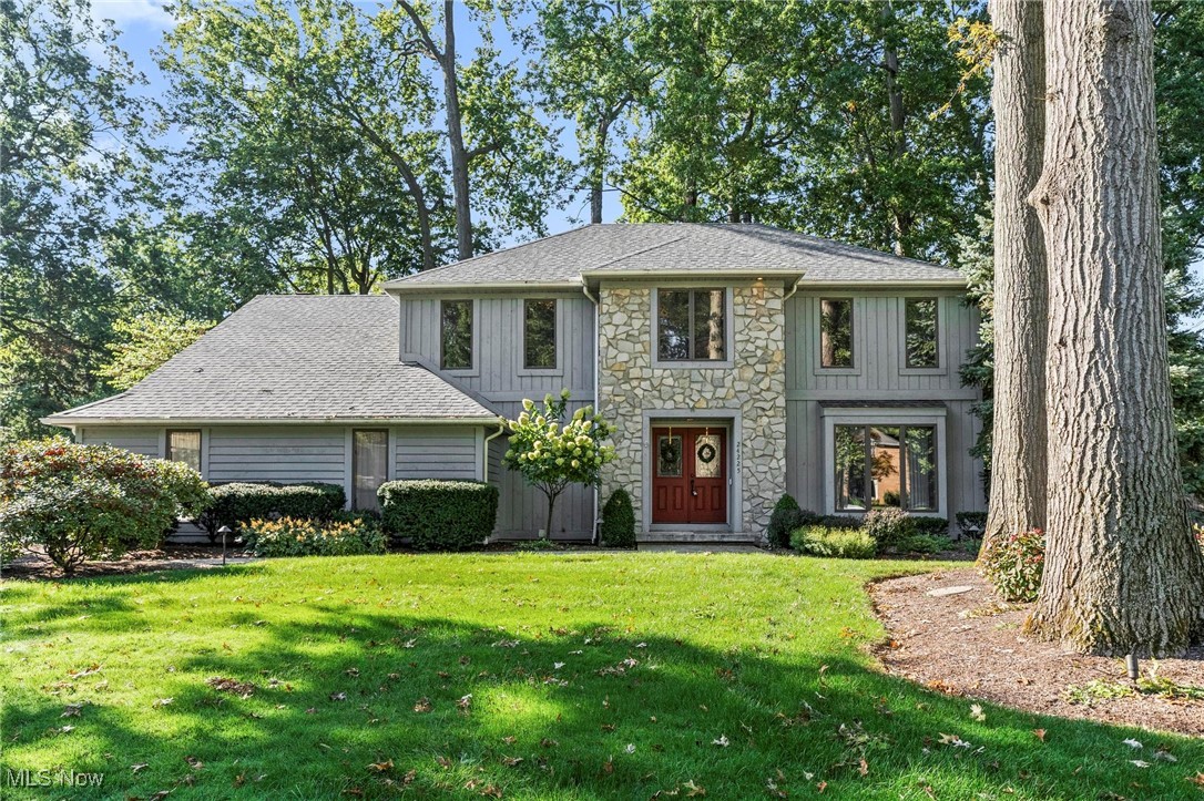 Welcome home to this beautifully designed 4-bedroom, 2 full/2 half bath home offering nearly 3,000 SF of above-grade living space on a quiet drive in Westlake. The entry opens into a spacious kitchen and seating area, flowing into a vaulted family room with an open layout. A formal living and dining room add flexibility for entertaining, while the oversized family room with stone fireplace overlooks the backyard and connects to a lofted home office leading to the primary bedroom. At the heart of the home is a generous eat-in kitchen with a U-shaped granite countertop, built-in oven, microwave, stovetop, and dishwasher, plus abundant counter and cabinet space. The private backyard features a beautiful deck, paver porch seating area, partial fencing, and gas grill hookup. A laundry/mud room on the main level connects to the nature stone-lined garage, with washer and electric dryer hookups, utility sink, and adjacent half bath. Upstairs offers 4 spacious bedrooms, 2 full baths, and walk-up access to an unfinished attic for added storage. The expansive primary suite includes dual sinks, a full bath, newly renovated walk-in closet, and adjoining loft office. The mostly finished lower level adds approx. 650 SF of space for recreation, hobbies, a 2nd office, or fitness, with ample unfinished storage, racks, and shelving. Located in desirable Westlake, this home blends private, refined living with convenience to shopping, highways, the airport, rec center, schools, and all the west side of Cleveland offers. Additional highlights include a whole-home Generac generator, newer HVAC, roof, driveway, sprinkler system, refinished paver patio and walkway, landscape lighting, alarm system, central vac, and more.