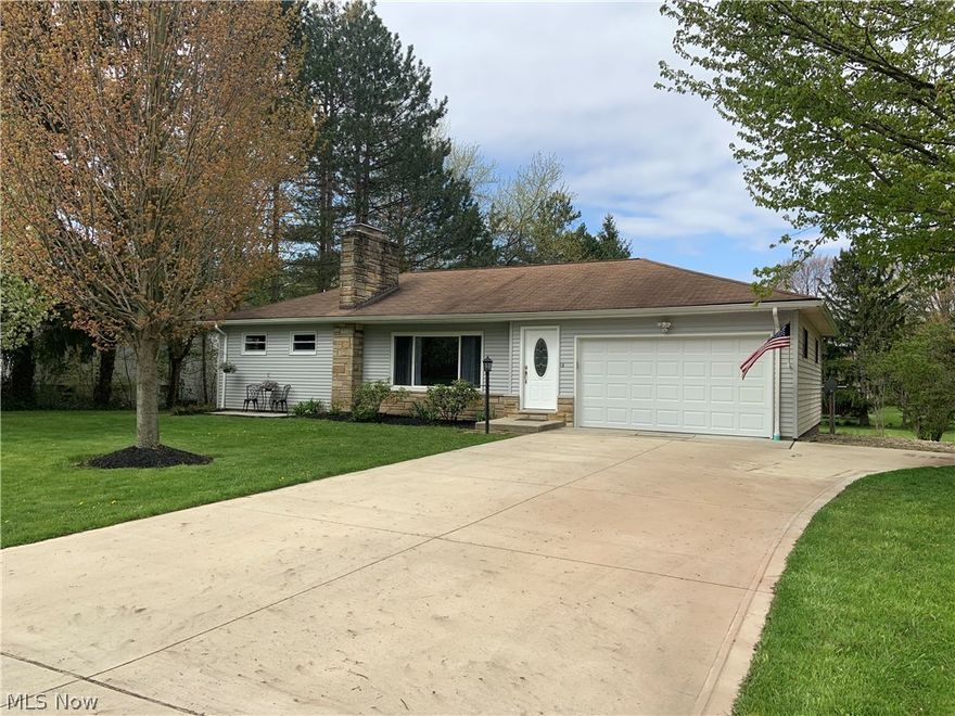 Very Appealing, and neat as a pin is this greatly updated three bedrooms ranch with a full basement and a half acre lot. Convenient and quiet street near the heart of Chesterland. Fresh paint, new stove and well pressure tank with furnace, hot water tank and electric panel in the last 4 years. Eat in kitchen, oak floors, two fireplaces and a deep garage for extra work area. Great curb appeal with attractive landscaping, newer cement driveway and large deck overlooking the deep backyard. Do not miss the retro 1950's paneled family room with built in bar and fireplace. An inviting, cozy and hidden surprise in an already awesome house.