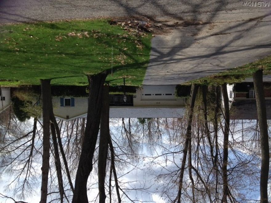 This beautiful property is waiting for you and wants to be your next home! Super large bedrooms, 2 and 1/2 baths. Exquisite floor plan with, formal dining room, large efficient eat-in kitchen, with a NEW FLOOR that you will love.   NEW BASEMENT, by A-1 Concrete Company, USDA APPROVED FINANCING, with "O" down!  HOME WARRANTY for Buyers as a gift from the Sellers.  Located in the heart of Canfield where everything worth going to is a stone's throw from this lovely property. Relaxing family room with gas fireplace and screened porch leading to a convenient area for parties and outdoor grilling.  All appliances stay, many updates, 2 car attached garage, minimal amount of maintenance, and  low utilities. Furnace 7 yrs., old, HWT approx., 7 yrs., Roof 7 yrs. Carpeting or HWD floor allowance, $750.00.  CANFIELD SCHOOLS.  Near banks, restaurants, post office, and stores. Come and see what a rare find this property is. Located on a quiet street in a great Canfield neighborhood. Don't wait, now