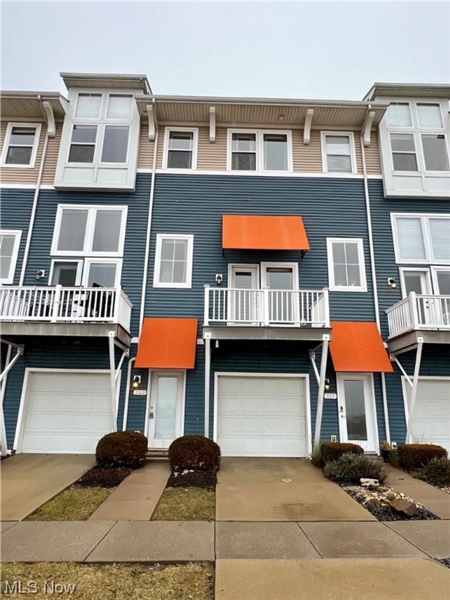 LOCATION, LOCATION!! This unit features a beautiful water view and is seconds from the lake! Enter the main level and enjoy tons of natural light beaming through the main living space with high ceilings! You will love the cozy gas fireplace, built in shelving, this is the perfect area to entertain large gatherings! The kitchen features a tile flooring, large island seating, great counter space, and tons of cabinets! A half bath, laundry room, a deck off the kitchen & front living space complete the main level. The second level features a large guest bedroom with on suite full bath, and a large master bedroom that features a walk in glass shower and large soaker tub! With a 2 car attached garage, pool and restaurant amenities, this is a must see!