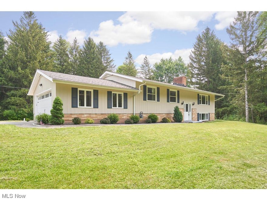 Welcome to this PRISTINE 3 bedroom home, located on a 3.3 acre wooded lot that offers complete seclusion and privacy. This property has been completely updated;( look under the "supplement" section for updates and dates), and shows pride of ownership throughout. Rooms include a large great room with vaulted ceiling, kitchen with eating area; trex deck on the entire back of the house; separate laundry room and rec room with fireplace in the walkout  lower level. Side load garage, newer landscaping. Property backs up to Furnace Run Metro Park; in area of upscale new homes; Revere Schools.