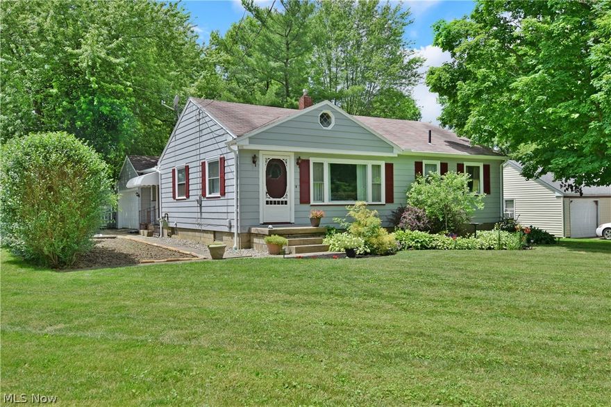 Enjoy this comfortably cozy 2-3 bedroom Champion home with tons of property and room to grow! Highlighting the corner lot with a meticulously landscaped front yard and fenced in, park-like rear; this residence offers a tasteful first floor with a full basement below to include a casual bar, rec space, laundry and tons of storage. Offering both formal and side entrances from the attached two car garage, you’ll be greeted by either a finished breezeway or a delightful living room; illuminated by a large picture window filling the room with natural light. Hardwood style floors run below as a central kitchen brings both eat-in dining and wrapping countertop space amongst an array of bright white custom cabinetry. Stainless appliances include sink and refrigerator while a built-in range includes stacked oven. The 3rd bedroom is currently being used as a dining room but can easily be reverted back to a bedroom. Opposite of that room, an illustrious full bath awaits near the spacious corner b