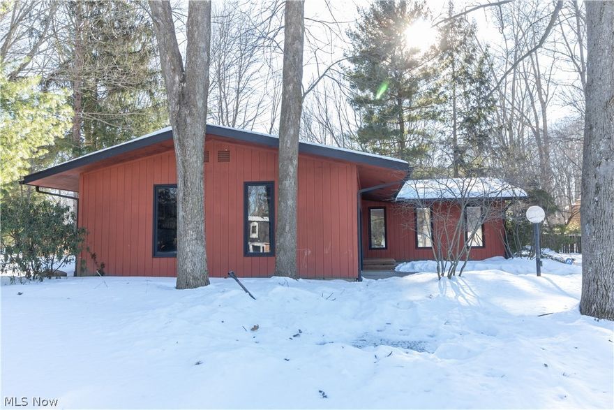 Magnificent, updated, open floor plan Ranch! Contemporary & mid-century charm combine to give you massive space for entertaining & family time!  Great room with all new luxury flooring, new floor-to-wall dramatic black fireplace, all white walls & recessed lighting, leads to open dining room & updated, modern white kitchen, with Jenn Aire stainless steel applicances & farmhouse sink with with slidering cutting board/basket. Back wall has sliders to 3-season sunroom that is surrounded by new (Nov 2021) oversized patio & privacy fence. Perfect entertaining area from front door to back patio area!! Large Primary bedroom has walk-in closet & ensuite bathroom with step-in shower & granite countertop, plus two more bedrooms & updated main bathroom with soaker tub & granite countertop. There is a 2-room "office" with lots of possibilities (laundry??) & includes a "wall of closets" in the second room. Lower level includes rec room with wet bar & built-in "desk" area with cuboards (sellers were