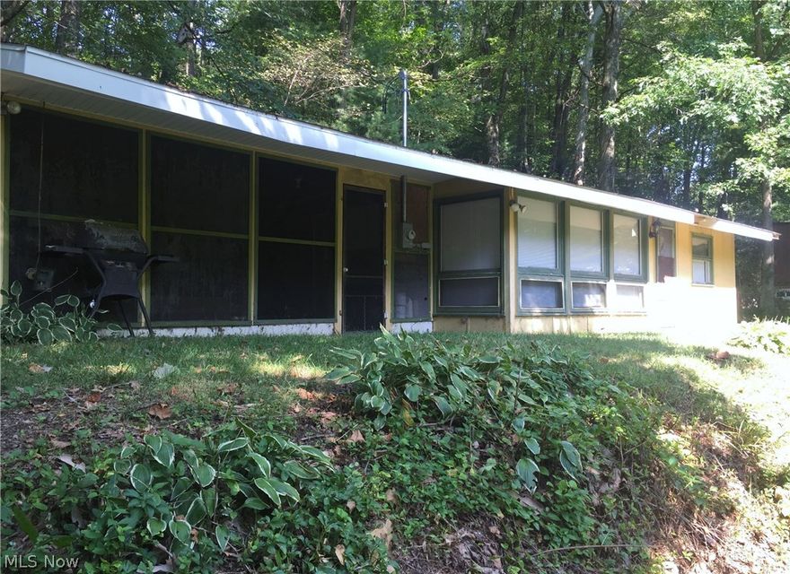 Fantastic summer retreat...Enjoy the great fishing Leesville Lake has to offer at this 2 bedroom 1 bath waterside cottage with a seasonal view of the lake and plenty of privacy on a quiet street with 7 lots. The screened in porch offers a wonderful place to entertain or rest after a long day on the lake. Updated 200 amp electric service and new well pump installed 2 years ago.