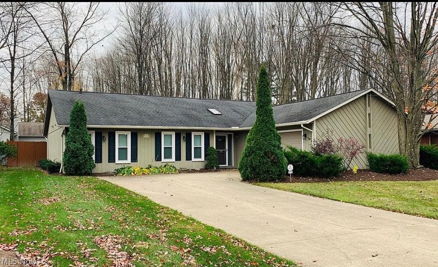 Welcome home to 14715 Hartford Trail located in the highly desired Trails of Strongsville Ohio! Single story living at its best! Updated ranch offers great open spaces with a large foyer leading to a spacious living room featuring a beautiful stacked stone wood burning fireplace, vaulted ceilings and newer laminate floors (2017) throughout the open areas! Living room also features a private wet bar with sink, mini fridge and plenty of storage! Open kitchen leads to a formal dining room with access to the newer sliding door (2016) to fenced in private backyard. Main bathroom remodeled (2017). Owner’s bedroom features vaulted ceiling, dual closets and a remodeled private bathroom (2017)! The mudroom features the laundry area, office space, large window for natural light and access to the 2-car side load garage. All appliances stay! Many updates include: newer HVAC and hot water heater (approx. 2015), newer double hung vinyl replacement windows (2016), front door Anderson screen (2016), n