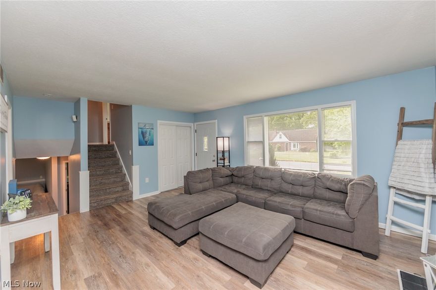 Mogadore split level home with four bedrooms and 2 full baths. The newer kitchen has beautiful quartz countertops and newer appliances. The home has newer flooring and is freshly painted. Living Room has a fireplace, and the dining room has French doors leading to the deck area. New exterior doors 2023. New furnace 2021. New Hot water tank 2021. The outdoor deck is a wonderful place to enjoy summer days. Plenty of storage throughout the home and in the basement. Time to preview this home for yourself!