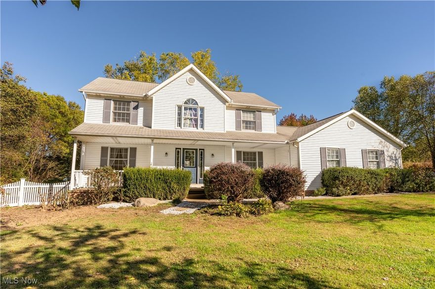 Country living setting on 2.38 acres in Canal Fulton, this 4 bedroom 2.5 bath Colonial delivers space, privacy and practical extras with a simple country feel. A traditional two-story layout provides an eat-in kitchen with granite countertops, living and family rooms for everyday flexibility, formal dining room and a convenient first-floor laundry. The outdoor space features a greenhouse with solar panel with batteries for fans and an the interior water line supports year-round starts, a 10×12 chicken shed (2019) with egg producing chickens and a few roosters.  It also features small cabin get away on a slab (2024) and offers a quiet spot for hobbies, storage or just plain relaxing with wood burner. The grounds are productive and inviting with fruit trees, grape vines, blueberries, elderberries, and currants, plus pecan, walnut planting & plenty of room to expand gardens or add raised beds.  Recent updates include Master bath shower added (July 2020) with flooring. New outdoor heat pump unit (Aug 2024), laundry room refresh with shelving and barn-door cabinets (Sept 2024), new water softener (June 2025), Wi-Fi garage door opener (2022), front yard vinyl fence installed (2020). Home has Generac whole house backup generator (2021) to keep you going if need be.  The setting feels comfortably rural yet remains close to Canal Fulton amenities, schools, parks, and commuter routes. Whether you’re planning a larger garden, building a pole building, setting up a workshop, or simply wanting extra elbow room, this property offers flexible spaces, and valuable outdoor features. Bring your own style and make practical improvements over time.  Turn this paradise into the home that fits your everyday needs and enjoy.