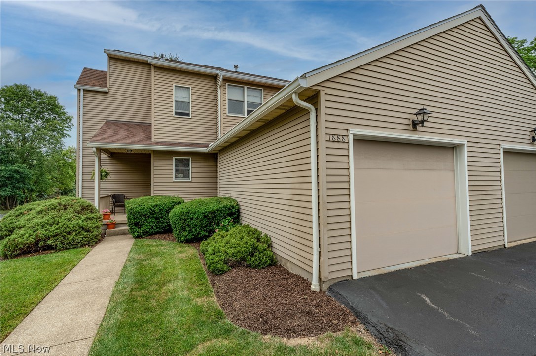 Welcome to 1888 Lillian Rd! This lovely, well-maintained condo is an END unit, and offers a large foyer entry, two bedrooms, 2 full baths, a large living room, a formal dining room, a loft, and a fully applianced kitchen. The master bedroom is very large and will accommodate king sized furniture as well as offering room for a sitting area. The 2nd bedroom on the 2nd floor would make a perfect office or guest bedroom. The large bath on the 2nd floor accomodates both bedrooms. The lower level is finished with a large family room, and there is a laundry area (washer and dryer conveys), and an additional space for storage. In June 2022 the condo was freshly painted and new carpet installed. The whole condo is fresh and neutral in decor! The sump pump and H20 were also recently replaced, as well as the kitchen refrigerator. From the formal dining area, there is a slider that leads to a private patio. A wall separates the patio area from the neighbor next door for added privacy. The associa