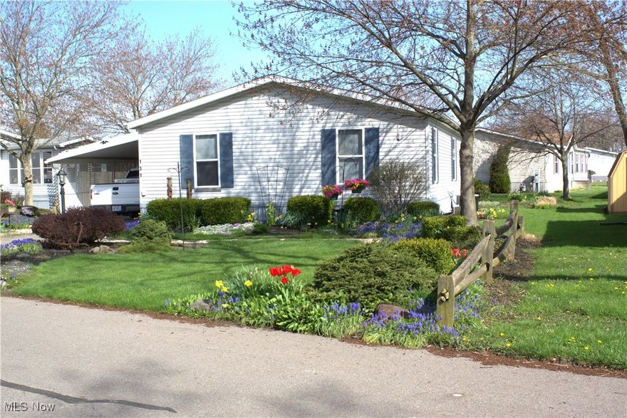 Welcome to this charming 2-bedroom, 2-bath double-wide home located in a desirable 55+ community! Step through the inviting sunroom—complete with a cozy gas heater and sliding glass doors—into your own private, fenced-in courtyard. An attached storage shed offers a perfect workshop space and can be conveniently accessed from inside the home.
Enjoy a spacious living room that flows into the open, eat-in kitchen featuring ample cabinetry and a built-in hutch. The primary bedroom offers a private en-suite bath with a shower stall, soaking tub, vanity, and toilet. A comfortable second bedroom and an updated hall bath provide additional convenience. The separate laundry room includes access to the backyard, where you’ll find another small storage shed.
The yard is thoughtfully divided by gorgeous Rose of Sharon bushes, complemented by beautiful flower gardens and lush landscaping. Appliances included: dishwasher, gas range, newer refrigerator, washer, and dryer. Move-in ready and full of charm—don’t miss this peaceful, well-kept home! Twin Lakes isn’t just a home—it’s a lifestyle. Enjoy: ~ Large clubhouse & fitness center ~ Outdoor patio & BBQ area ~ Pickleball & bocce courts ~ Dog park & social activities like line dancing, cards, book club, and Browns watch parties! All appliances and bedroom furniture included! PARK REQUIREMENTS: 55+ yr old, 650+ credit score, pass background check, no bankruptcy in past 3 years. Don’t wait—schedule your private showing today and see why everyone loves Twin Lakes!