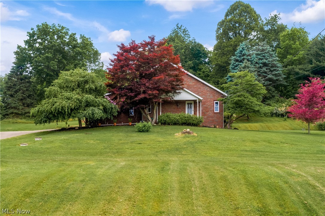 Must see! Original owner for this custom built estate tucked away on a private 2 acres. This lovely home sits on a hill side with beautiful country views. You'll love the vaulted wood beamed ceilings in the living room with a wood burning stove. All new flooring and countertops through out the entire house! A large eat in kitchen, first floor bedroom and bathroom completes the first floor. Upstairs you have two more bedrooms and a Jack and Jill bathroom. A full basement with a walk out door, work shop and a 2nd wood burning stove offers tons of storage or could be finished off to your liking. This home has an oversized 2 car attached garage and a second outbuilding on the property. Well and Septic POS completed. Close to the lakes, trails, and shops nearby. This home is waiting for its new steward to enjoy the peace and serenity mother nature has to offer. Schedule your showing today!