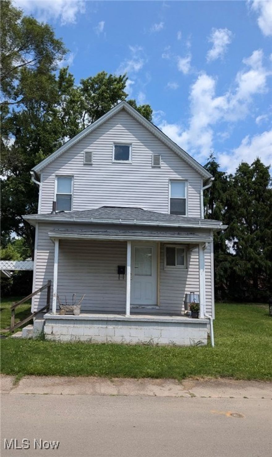 Charming home in the heart of Rittman. Opportunity awaits, whether your a first time buyer or investor this home is waiting for someone to make it their own! New roof June 2025. Beautiful wood floors in the living room and dining room. Unique arches and plenty of windows throughout welcome you to a comfortable and inviting space. 24x18 detached garage with concrete floor.  Nice size backyard.  Enclosed back porch.  Call your favorite Realtor to schedule a showing before its too late!