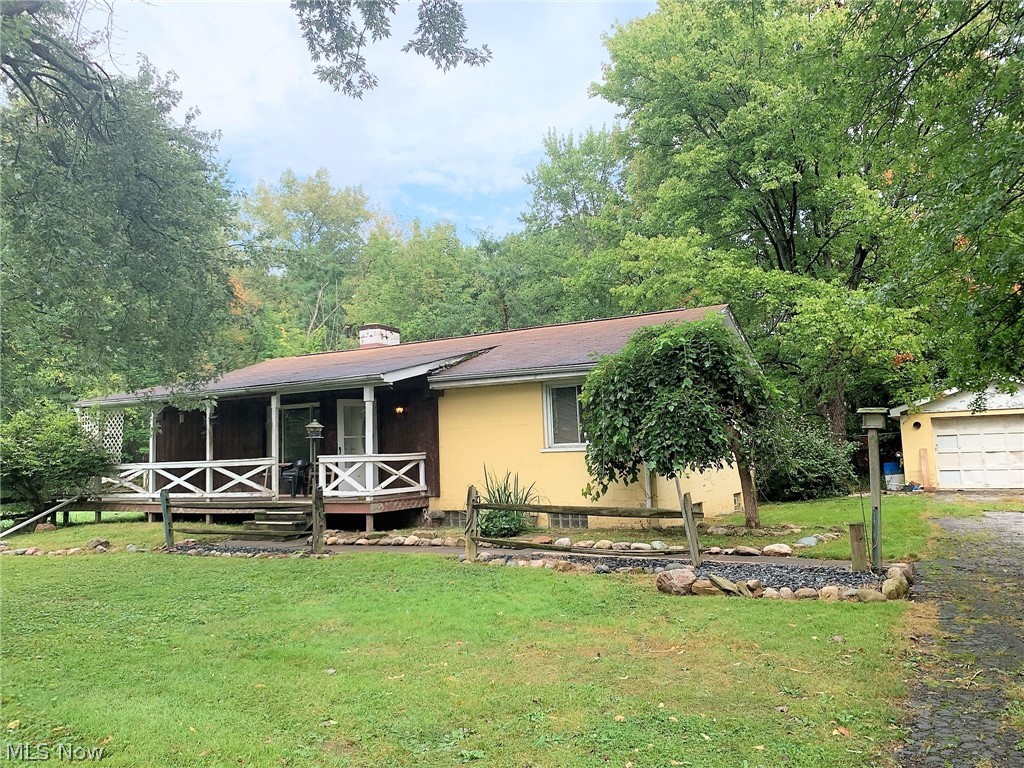 Here is your chance to own over 3 Acres of property in Olmsted Falls! The 150 x 1065 wooded lot backs up to the Rocky River. This ranch home offers a spacious kitchen and dining area, a family room with a newer wood burner fireplace insert and blowers, has 2 bedrooms and 1 full bathroom, a first floor laundry room and is ready for you to put in a little elbow grease to make it your own.
There is a new furnace in the basement that can be hooked up to replace the old. The 5 Gallon Vertical Pressure Tank has been replaced, as well as the septic system and clean outs. Plumbed for a 2nd bathroom in basement.