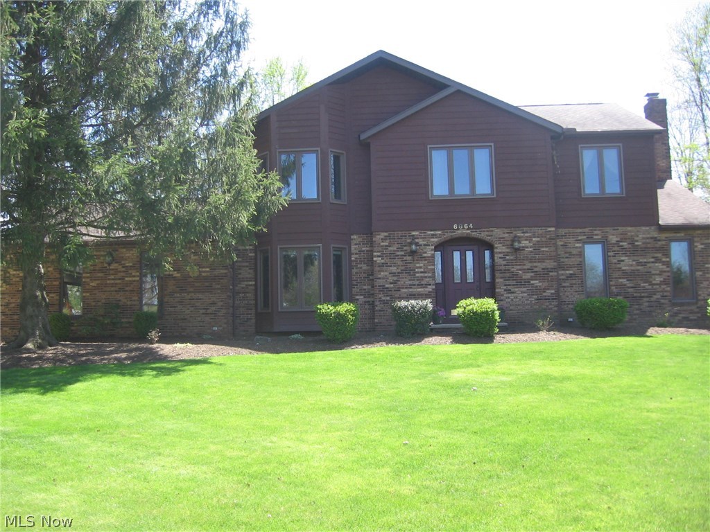This immaculate, well maintained, 1 owner home is a must see! Step through the front door into tastefully decorated foyer with coat closet. To your left is formal dining room featuring bay window and gorgeous wainscoting. Go right into large living room which opens to large family room with a bay window and fireplace. Open concept is understated here as family room blends seamlessly into huge kitchen featuring a large island, granite counters, large pantry cabinets, and sliding patio doors leading to deck. The first floor is completed by recently remodeled half bath, big laundry room and entrance to attached garage. The master suite upstairs features large bedroom, walk in closet, make-up table and master bath re-done in the past year with a beautiful tile and glass shower. 3 other bedrooms share another full bath with new granite counter and new flooring. Upgrades in last 6-10 years include roof, windows, furnace, AC, and kitchen remodel. With summer almost here, you'll want to be out