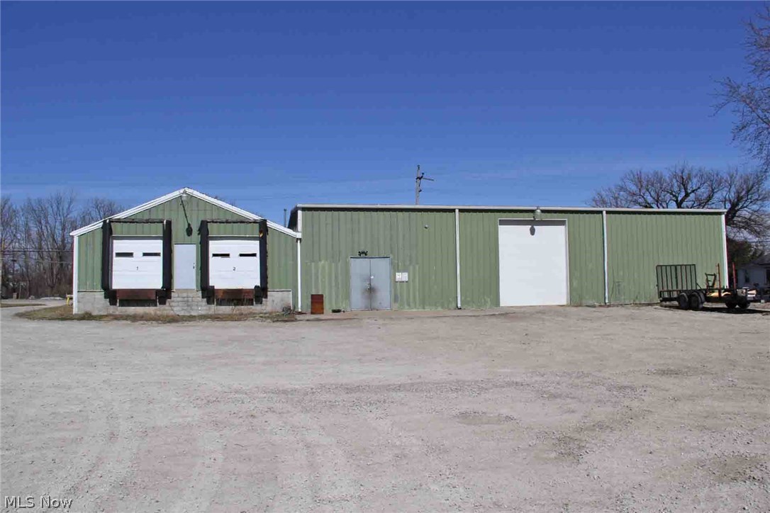 Versatile 5770 sq ft building on 1.68 acres. Bring your ideas. Approx 4320 sq ft of warehouse and 1450 sq ft of office space. Loading docks, overhead doors, insulated, and gas heat throughout. Recently used as a truck/auto repair shop. Also would be great for indoor/outdoor boat storage or repairs, light manufacturing/industrial, retail or distribution. Extensive parking/storage behind the building. Room for expansion.