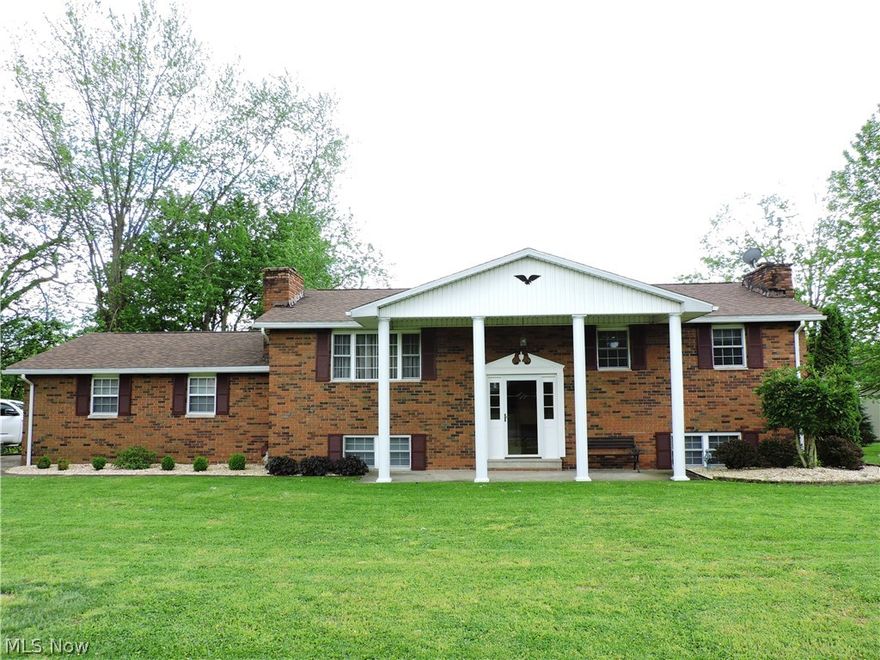 Well maintained & updated 4 bedroom, brick home has great curb appeal w/its stately covered front porch w/pillars, is situated on private drive w/mature trees, .47 acre level lot, offers an open & flowing floor plan & is ready for you to just move in & enjoy! Features light & airy living room w/great furniture space, attractive WBFP w/built-ins on each side,  table space kitchen w/wall for large hutch, bar area for 4-5 bar stools, good counter space, abundance of cabinetry & slider door to the screened porch with perfect for relaxing or entertaining while overlooking the back yard or Muskingum River view.  The screened porch has door to concrete patio area &  backyard w/mature trees. The family room/rec room has WBFP, great space for a big screen TV, sectional & still room for a pool table.  There are 4 bedrooms (master bedroom with double closets and private half bath that can easily be converted to a full bath) and large hall bath with tub/shower, tile flooring, linen closet and grea