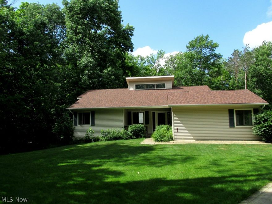 "4.66 of gorgeous wooded acres surrounded on 2 sides by Holden Arboretum property/approx. 1 acre is cleared/ the house sits back from the street about 225 feet/ house is near end of dead end street/the house has super insulated double wall construction w/ 12" thick walls and insulated bsmt/1st floor laundry room/Trane 90+ gas furnace and high efficiency C/A/ Kinetco water softener/2 car att gar plus 2 car det. gar w/a shed attachen to the back housing a fully automatic whole house generator 20KW/Triple pane Andersen windows on 1st floor/living room ceiling rises to 18 ft with electric opening windows at top/ woodburning fireplace with heatalator/slate entrance area/ 16 x 14 rear deck and covered front porch/ full base ment under entire house/ large master suite/all appls stay/great floor plan and lots of storage/scenic views from every window and lots of privacy/ this is a must see property for the discriminating buyer on a quiet street bordering Kirtland Hills/very/ this is a custom b