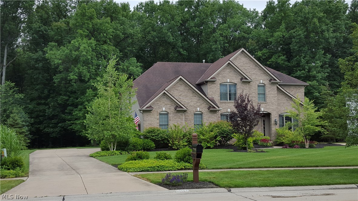 Gorgeous Custom Built home in highly sought Avon Development on dead end street, backs up directly to Miller Nature Preserve of Lorain County Metro Park! This beautifully appointed home has stunning custom built back yard entertainment paver patio w/ built in fire pit accented by light posts & seating benches! Brick front exterior & hip roof system sets this home apart from the rest! HUGE kitchen was remodeled: gorgeous granite, large seating island, tiled backsplash highlights undermount sink, touch faucet, accent lighting, cherry cabinetry, porcelain look tile floor & stainless steel appliances! 2 story great room opens to eat-in-kitchen, has full wall of windows surrounding the fireplace & view to loft above the 2nd stair system. 2-story foyer shows off the full stair system flanked by home office /study & front Living Room then connects to formal Dining Room with accent wainscoting & crown molding. 1st floor is finished by both a Powder Bath & large laundry room with utility sink.