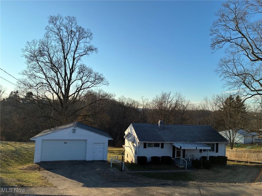 2 Bedroom/1.5 Bath Ranch home features an equipped kitchen/dining combo with sliding doors to deck overlooking the expansive back yard.  Lower level includes a Recreation room w/fireplace & lots of storage.  2 car detached garage.  New furnace.  Convenient to Three Springs Drive.